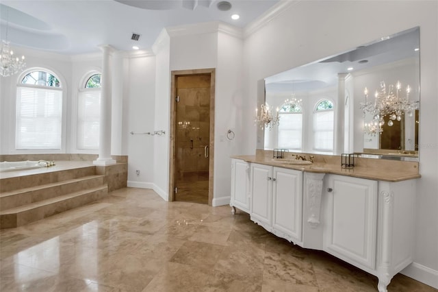 550 Dove Pointe, Osprey, FL 34229 - bathroom featuring a chandelier, a garden tub, vanity, a shower stall, and ornate columns