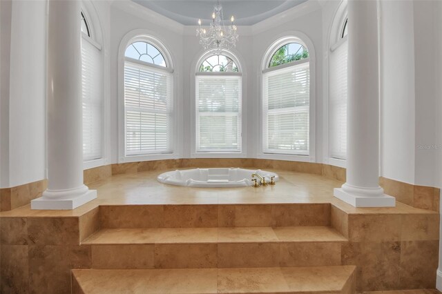550 Dove Pointe, Osprey, FL 34229 - full bathroom with ornate columns, healthy amount of natural light, and a bath