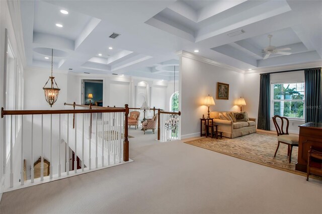 550 Dove Pointe, Osprey, FL 34229 - living area with an upstairs landing, carpet, a ceiling fan, recessed lighting, and a tray ceiling