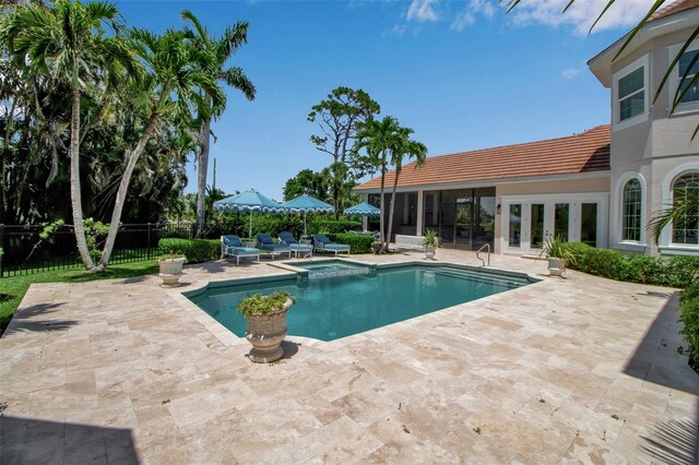 550 Dove Pointe, Osprey, FL 34229 - view of pool featuring french doors, a patio, and a pool with connected hot tub