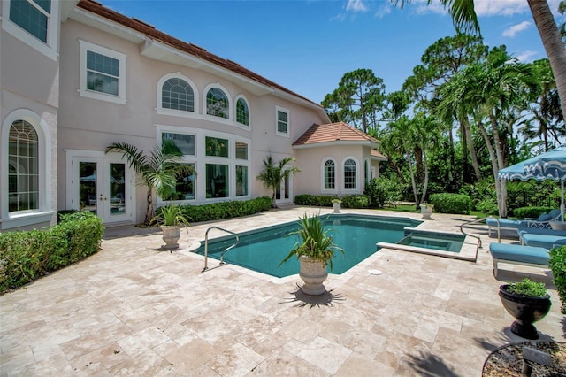 550 Dove Pointe, Osprey, FL 34229 - view of swimming pool featuring french doors, a patio, and a pool with connected hot tub