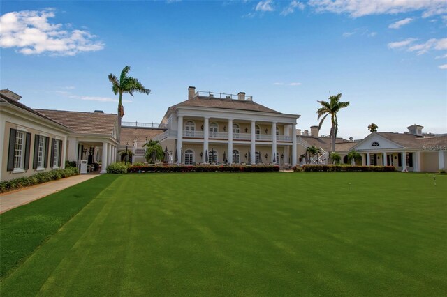 550 Dove Pointe, Osprey, FL 34229 - rear view of house featuring a putting area