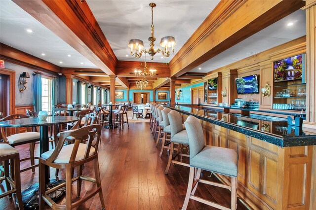550 Dove Pointe, Osprey, FL 34229 - dining space with dark wood-style floors, a chandelier, beam ceiling, and recessed lighting