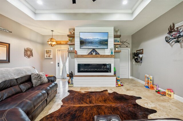 15780 Wilson Rd, Sarasota, FL 34240 - living area with a raised ceiling, crown molding, a large fireplace, and recessed lighting