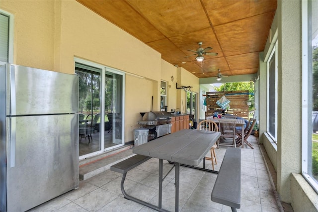 15780 Wilson Rd, Sarasota, FL 34240 - sunroom / solarium featuring ceiling fan and outdoor dining area