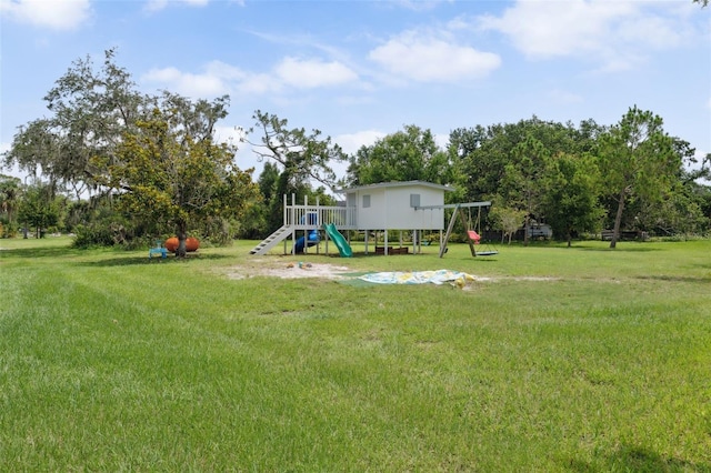 15780 Wilson Rd, Sarasota, FL 34240 - view of grassy yard with a playground and view of scattered trees