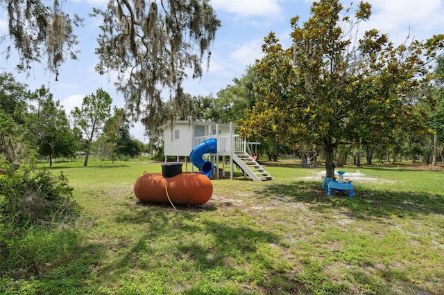 15780 Wilson Rd, Sarasota, FL 34240 - view of grassy yard featuring a playground and view of wooded area