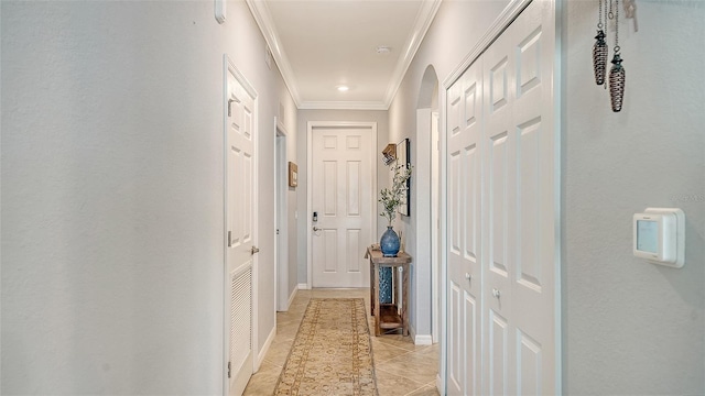 1030 Tidewater Shores Loop Unit 307, Bradenton, FL 34208 - hallway with crown molding and light tile patterned floors