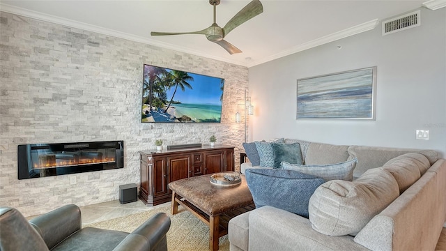 1030 Tidewater Shores Loop Unit 307, Bradenton, FL 34208 - living room with a ceiling fan, ornamental molding, and a fireplace