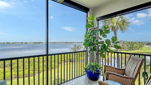 1030 Tidewater Shores Loop Unit 307, Bradenton, FL 34208 - unfurnished sunroom with a water view and plenty of natural light