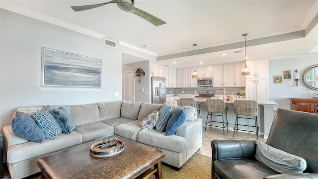 1030 Tidewater Shores Loop Unit 307, Bradenton, FL 34208 - living room with ornamental molding, ceiling fan, and recessed lighting