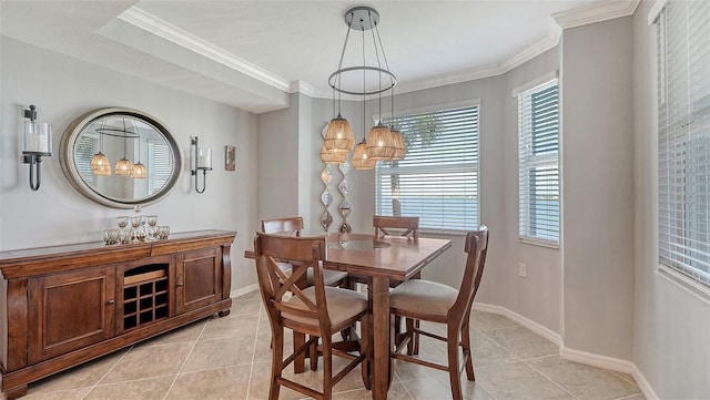 1030 Tidewater Shores Loop Unit 307, Bradenton, FL 34208 - dining room featuring light tile patterned flooring, a chandelier, healthy amount of natural light, and crown molding