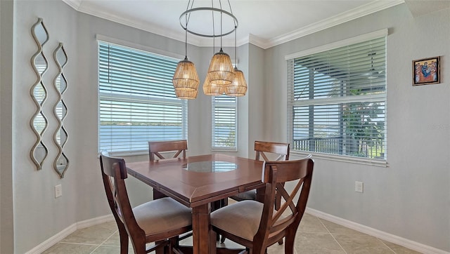 1030 Tidewater Shores Loop Unit 307, Bradenton, FL 34208 - dining area featuring healthy amount of natural light, light tile patterned floors, and ornamental molding