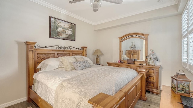 1030 Tidewater Shores Loop Unit 307, Bradenton, FL 34208 - bedroom featuring light wood finished floors, multiple windows, crown molding, and ceiling fan