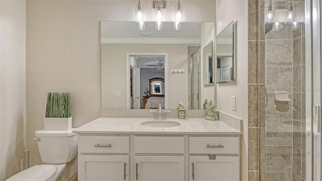 1030 Tidewater Shores Loop Unit 307, Bradenton, FL 34208 - bathroom featuring vanity, connected bathroom, a tile shower, ornamental molding, and a textured wall