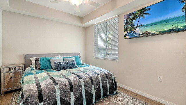 1030 Tidewater Shores Loop Unit 307, Bradenton, FL 34208 - bedroom featuring wood finished floors and a ceiling fan