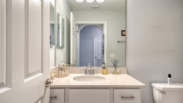 1030 Tidewater Shores Loop Unit 307, Bradenton, FL 34208 - bathroom featuring vanity and a textured wall