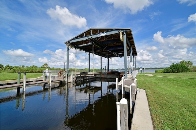 1030 Tidewater Shores Loop Unit 307, Bradenton, FL 34208 - dock area with boat lift, a lawn, and a water view