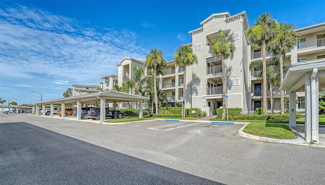 1030 Tidewater Shores Loop Unit 307, Bradenton, FL 34208 - view of apartment building / complex featuring covered and uncovered parking