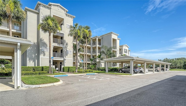 1030 Tidewater Shores Loop Unit 307, Bradenton, FL 34208 - view of apartment building / complex with covered and uncovered parking