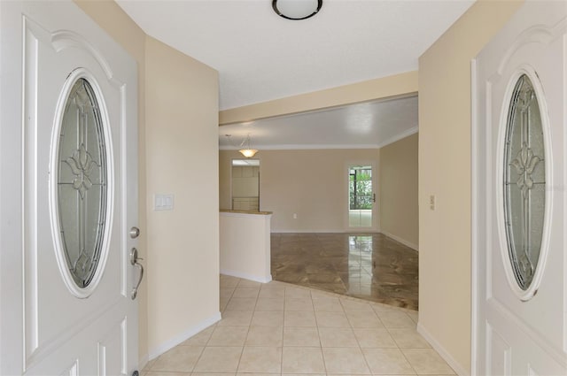 5124 Palm Aire Dr, Sarasota, FL 34243 - entryway featuring baseboards and crown molding