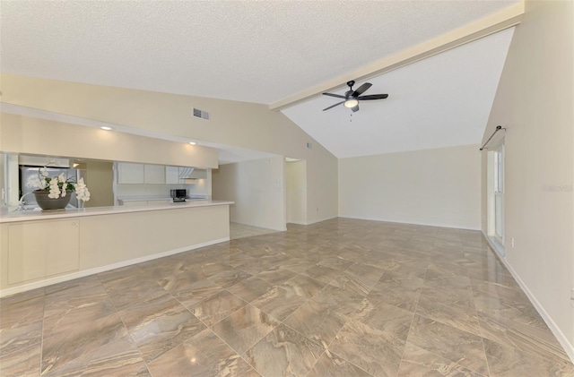 5124 Palm Aire Dr, Sarasota, FL 34243 - unfurnished living room featuring ceiling fan, a textured ceiling, and light marble finish flooring