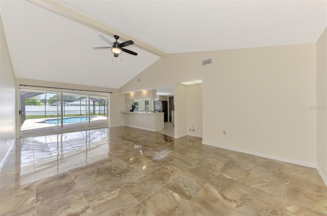 5124 Palm Aire Dr, Sarasota, FL 34243 - empty room featuring light marble finish floors, ceiling fan, high vaulted ceiling, and beam ceiling