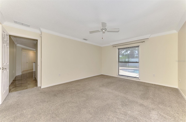 5124 Palm Aire Dr, Sarasota, FL 34243 - carpeted spare room with a ceiling fan and crown molding