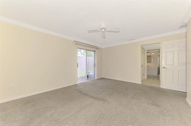 5124 Palm Aire Dr, Sarasota, FL 34243 - spare room featuring light colored carpet, crown molding, and ceiling fan