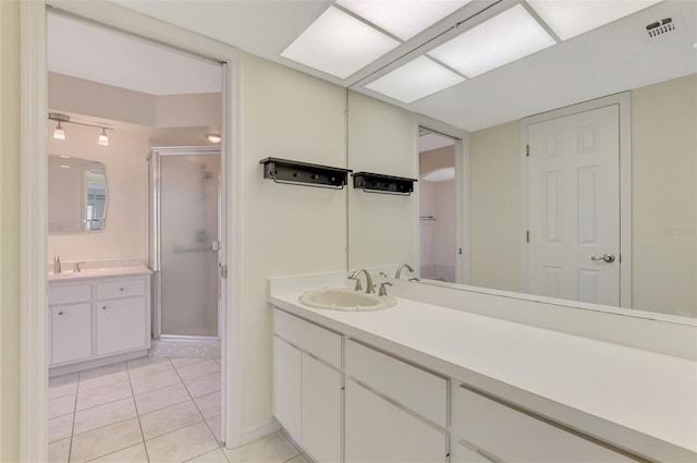 5124 Palm Aire Dr, Sarasota, FL 34243 - full bath featuring a stall shower, tile patterned floors, and vanity