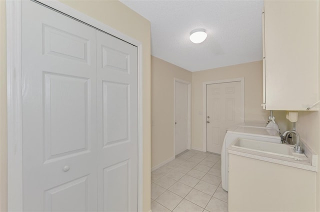 5124 Palm Aire Dr, Sarasota, FL 34243 - laundry area featuring light tile patterned flooring and baseboards