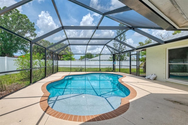 5124 Palm Aire Dr, Sarasota, FL 34243 - view of swimming pool featuring a fenced backyard, a patio, and a lanai