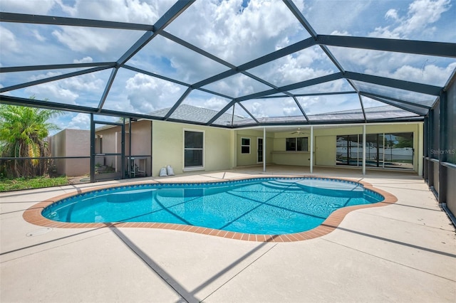 5124 Palm Aire Dr, Sarasota, FL 34243 - outdoor pool featuring a patio, a ceiling fan, and a lanai