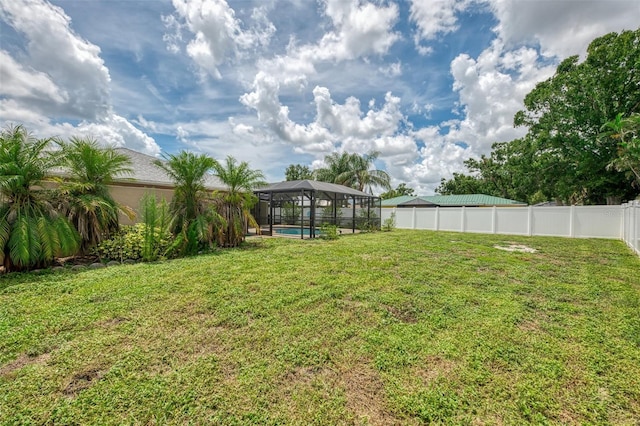 5124 Palm Aire Dr, Sarasota, FL 34243 - fenced backyard with a lanai