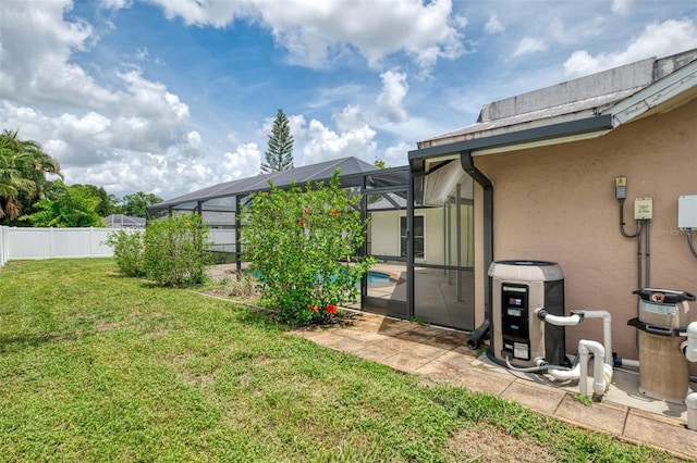 5124 Palm Aire Dr, Sarasota, FL 34243 - view of yard with glass enclosure and a patio