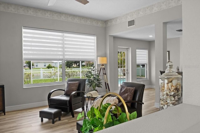 11839 Shrewsbury Ln, Parrish, FL 34219 - sitting room featuring wood finished floors, healthy amount of natural light, and ceiling fan