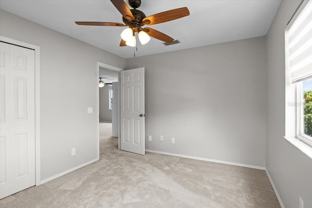 11839 Shrewsbury Ln, Parrish, FL 34219 - unfurnished bedroom featuring light colored carpet, a closet, and a ceiling fan