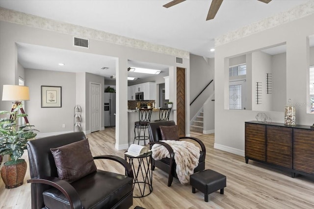 11839 Shrewsbury Ln, Parrish, FL 34219 - living area featuring stairs, a ceiling fan, light wood-type flooring, and recessed lighting