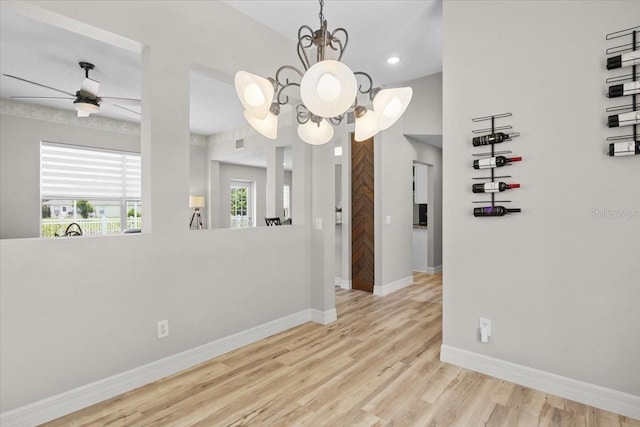 11839 Shrewsbury Ln, Parrish, FL 34219 - unfurnished room featuring wood finished floors, a chandelier, recessed lighting, and a ceiling fan