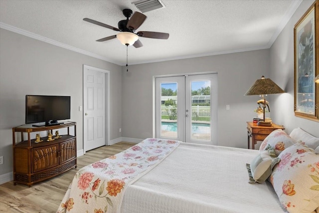 11839 Shrewsbury Ln, Parrish, FL 34219 - bedroom with access to exterior, light wood-style floors, a textured ceiling, ornamental molding, and a ceiling fan