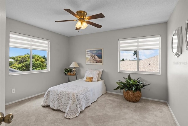 11839 Shrewsbury Ln, Parrish, FL 34219 - carpeted bedroom with a textured ceiling and ceiling fan