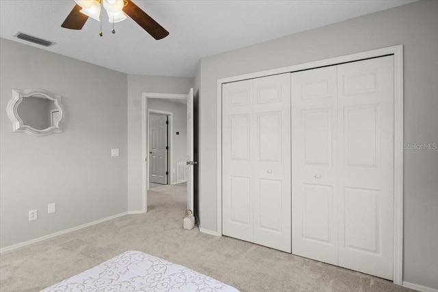 11839 Shrewsbury Ln, Parrish, FL 34219 - unfurnished bedroom featuring carpet, a closet, and a ceiling fan