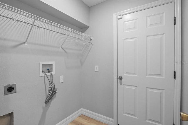 11839 Shrewsbury Ln, Parrish, FL 34219 - washroom with hookup for a washing machine, hookup for an electric dryer, and light wood-style flooring