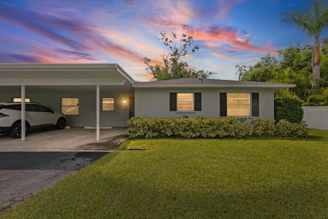 2115 9th Ave W Unit 3D, Bradenton, FL 34205 - ranch-style home featuring stucco siding, a front yard, and a carport
