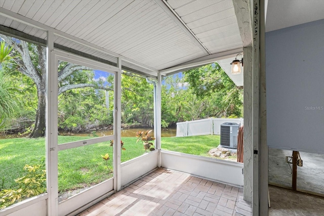 2115 9th Ave W Unit 3D, Bradenton, FL 34205 - unfurnished sunroom featuring view of scattered trees