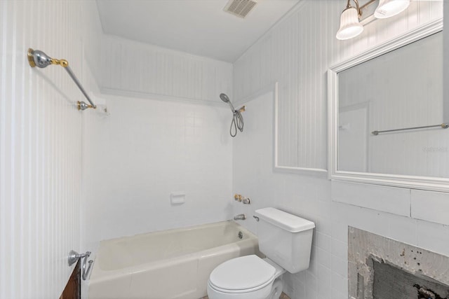 2115 9th Ave W Unit 3D, Bradenton, FL 34205 - bathroom with bathing tub / shower combination, a fireplace, and tile walls