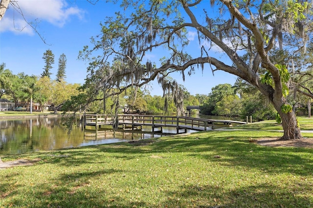 2115 9th Ave W Unit 3D, Bradenton, FL 34205 - dock area with a yard and a water view