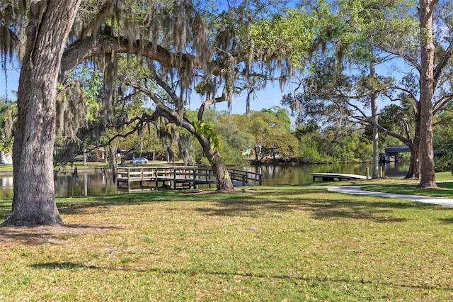 2115 9th Ave W Unit 3D, Bradenton, FL 34205 - view of community featuring a yard and a water view