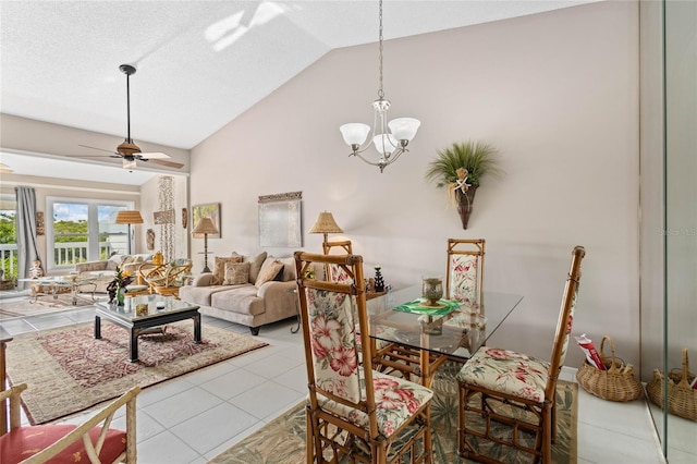 805 Waterside Ln, Bradenton, FL 34209 - dining area with lofted ceiling, ceiling fan, tile patterned flooring, and a chandelier