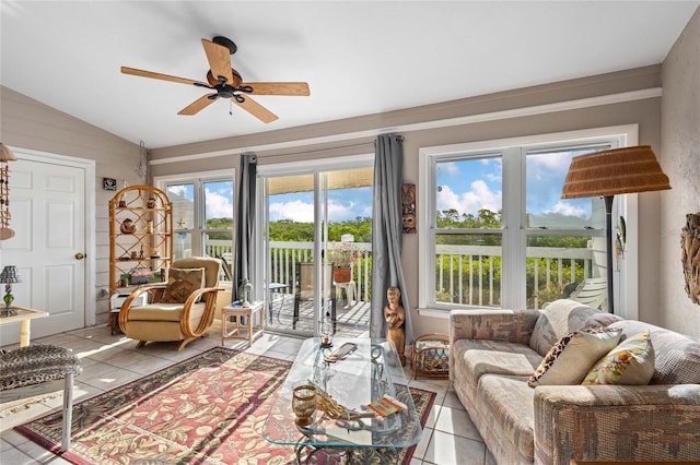 805 Waterside Ln, Bradenton, FL 34209 - living room featuring light tile patterned floors, lofted ceiling, and a ceiling fan
